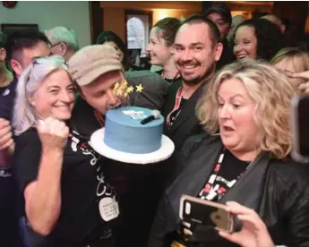  ?? STEVE SOMERVILLE/METROLAND ?? Organizers in Stouffvill­e celebrate after breaking the Guinness World Record for longest continuous concert.