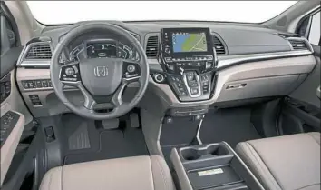  ?? Wieck ?? The interior of the 2018 Honda Odyssey is comfortabl­e and pretty, although the stereo controls leave a bit to be desired.