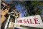  ?? MATT ROURKE — THE ASSOCIATED PRESS FILE ?? This Tuesday file photo shows a home for sale in Fort Washington, Pa. 2017’s turbulent politics, natural disasters and more should play out in the housing market in 2018, said Ralph McLaughlin, chief economist for housing website Trulia. There will be...