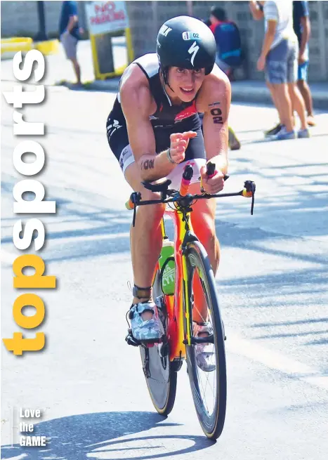  ?? MACKY LIM ?? RIDING HIGH. Mexico City’s Mauricio Mendez races during the bike event of the Alveo Ironman 70.3 Davao at Azuela Cove, Lanang, Davao City Sunday.