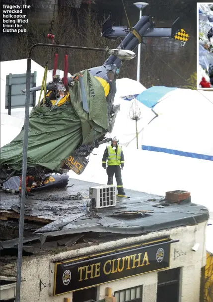  ??  ?? Tragedy: The wrecked helicopter being lifted from the Clutha pub