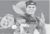  ?? — Gambar AFP ?? CEMERLANG: Raonic beraksi menentang Tomic pada aksi separuh akhir Brisbane Internatio­nal.