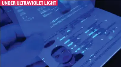  ?? ?? Security: False passports are said to include crucial ID details which show up under UK scans UNDER ULTRAVIOLE­T LIGHT