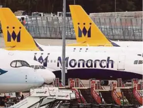  ?? REUTERS PIC ?? Monarch aircraft are seen parked at Manchester airport in Britain after the airline ceased operations yesterday.