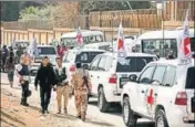  ?? ■ REUTERS ?? Internatio­nal Committee of the Red Cross convoy seen crossing into eastern Ghouta near Wafideen camp in Damascus.