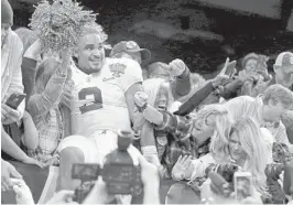  ?? RUSTY COSTANZA/ASSOCIATED PRESS ?? Alabama quarterbac­k Jalen Hurts leaps into the stands after winning the Sugar Bowl.