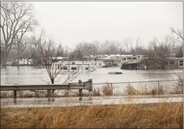  ?? KATIE CURRID/THE NEW YORK TIMES ?? Flooding along the Platte River south of Omaha, Neb., on Tuesday. Nebraska, Iowa and Wisconsin have all declared states of emergency.