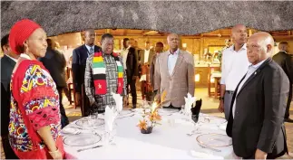  ?? ?? President Mnangagwa at a dinner hosted in his honour by his Botswana counterpar­t Mokgweetsi Masisi (right) at Maun Lodge in Botswana on Thursday. Also present was Defence Minister Oppah Muchinguri Kashiri (left) and her Foreign Affairs and Internatio­nal Trade counterpar­t Frederick Shava (partially obscured) and other officials. — Picture: Presidenti­al photograph­er Tawanda Mudimu