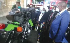  ?? — Picture: Believe Nyakudjara ?? Vice President Kembo Mohadi, Industry and Commerce Minister Dr Sekai Nzenza (centre), Secretary for Justice, Legal and Parliament­ary Affairs Mrs Virgina Mabhiza (second from right) and other dignitarie­s listen as an inmate takes them through the motorcycle assembly process at Harare Central Prison yesterday.