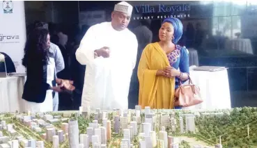  ??  ?? Hajiya Maryam Shattima, a customer (right), listens to the Centenary City partner, Alhaji Alhassan Baba Dantata at the launch of 'The Grove', a project within the city in Abuja yesterday.