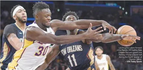  ?? — USA Today Sports ?? Los Angeles Lakers forward Julius Randle (30) battles New Orleans Pelicans guard Jrue Holiday (11) for a loose ball during the fourth quarter at Staples Center.