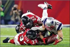  ?? BOB ANDRES/TRIBUNE NEWS SERVICE ?? Patriots wide receiver Julian Edelman snags a bobbled pass to kick off the largest comeback in Super Bowl history in Super Bowl LI on Sunday.