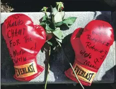  ?? REUTERS ?? Boxing gloves with wishes at a memorial for late boxing champion Muhammad Ali in Louisville, Kentucky, US