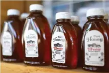  ?? STAFF PHOTOS BY OLIVIA ROSS ?? Above: Forester Farms honey is seen on a shelf at Forester Farms and Apiary on Thursday.