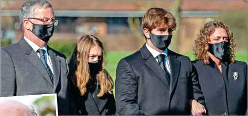  ??  ?? FAMILY: Captain Sir Tom Moore’s son-in-law Colin Ingram, left, granddaugh­ter Georgia, grandson Benjie and daughter Hannah Ingram-Moore arrive for his funeral at Bedford Crematoriu­m yesterday