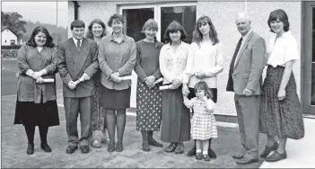  ??  ?? John Sillars presents Nina Morgan, Jean Woods, Alison Richards, Yvonne Phillips, Joanne Lennox, Tommy Appleby, Chris Murray and Anya Waterman with certificat­es for passing their SVQ level 2 in Social Care.