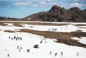  ?? AFP ?? Patches of white The Tahoe ski resort in California last year after a drought depressed the amount of snow, leaving ski resorts in a lurch.