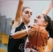  ?? JAMES BEAVER/FOR MEDIANEWS GROUP ?? Souderton’s Casey Harter (14) looks to the net to get a shot off over Pennridge’s Evelyn Loughery (22) Friday night at Souderton Area High School.