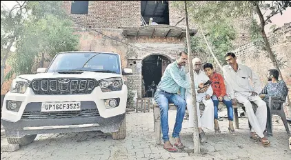  ?? BIPLOV BHUYAN/HT PHOTO ?? In Ranhera village, Balbhadr Singh, 85, got ₹24 crore as compensati­on for the land he gave up. He is now rebuilding his house and has purchased a new SUV.