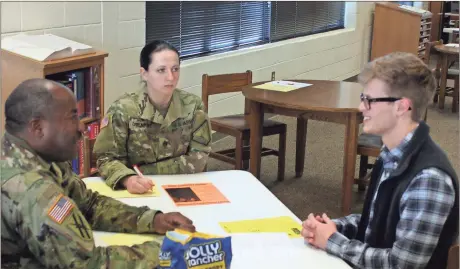  ?? Doug Walker / Rome News-Tribune ?? Sgt. Rico Jones (from left) and Sgt. Allison Davenport conduct a mock interview with Pepperell senior Will Bagwell during the High School 101 job skills exercise.