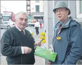  ?? (Pic: The Avondhu Archives) ?? Sharing a quick word while supporting Daffodil Day in Fermoy in 2006 were Tommy O’Brien, Fermoy (left) and Joe Phelan.