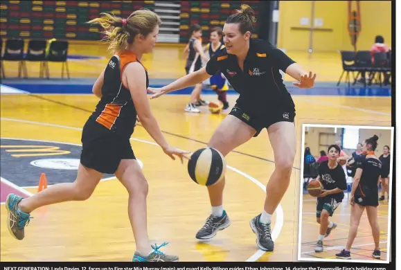  ?? Pictures: SCOTT RADFORD- CHISHOLM ?? NEXT GENERATION: Layla Davies, 12, faces up to Fire star Mia Murray ( main) and guard Kelly Wilson guides Ethan Johnstone, 14, duringi theth Townsville­To nsville Fire’s holiday camp held at Townsville Stadium.