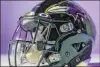  ?? Oakley The Associated Press ?? A Baltimore Ravens helmet is fitted with the plastic face shield designed by Oakley.