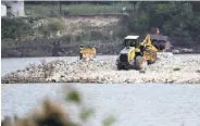  ?? David J. Phillip / Associated Press ?? Crews work Sept. 13 at the San Jacinto River Waste Pits site, where high dioxin levels have been found.