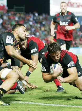  ??  ?? In at the corner: Ben Funnell scores for Crusaders