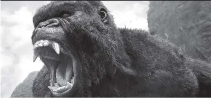  ?? WARNER BROS. PICTURES VIA AP ?? King Kong roars in a scene from, “Kong: Skull Island.” The movie beat out “Logan” for the top spot at the weekend box office.
