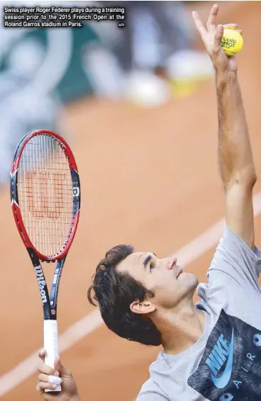  ?? AFP ?? Swiss player Roger Federer plays during a training session prior to the 2015 French Open at the Roland Garros stadium in Paris.