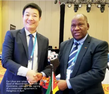  ??  ?? Cai Lihua and Juliao Dmande, head of Mozambique Chamber of Commerce, celebrate the signing of a cooperativ­e agreement in Hangzhou in April
