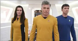  ?? ?? Rebecca Romijn, Anson Mount and Ethan Peck in “Star Trek: Strange New Worlds”