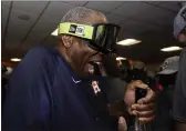  ?? DAVID J. PHILLIP — THE ASSOCIATED PRESS ?? Manager Dusty Baker Jr. celebrates in the locker room after the Astros’ 4-1World Series win against the Phillies in Game 6on Sunday.