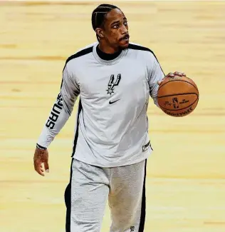  ?? Harrison Barden / Getty Images ?? Demar Derozan missed four games after the burial of his father and returned to the lineup Friday. “He did what was necessary for his family,” Spurs coach Gregg Popovich said.