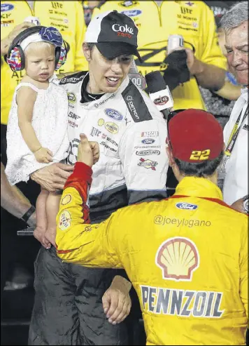  ?? WILFREDO LEE / ASSOCIATED PRESS ?? Brad Keselowski holds his daughter, Scarlett, after winning the July 2016 race at Daytona. Now he wants to win the 500 for the first time.