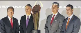  ?? JOHN BAZEMORE / AP ?? All four coaches in this year’s playoff — Nick Saban of Alabama (from left), Chris Petersen of Washington, Ohio State’s Urban Meyer and Dabo Swinney of Clemson — pose with the trophy.