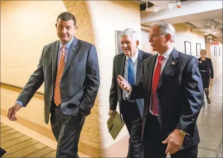  ?? J. SCOTT APPLEWHITE Associated Press ?? FORMER Rep. David Valadao, left, of California’s Central Valley with Republican colleagues in the U.S. Capitol in June 2018. Valadao is leading in his bid to regain the seat he lost to TJ Cox by just 862 votes. It’s considered the most competitiv­e congressio­nal race in the state.