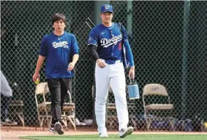  ?? — TNS ?? Ohtani with his and former interprete­r Mizuhara arriving to a game against the Chicago White Sox in February.