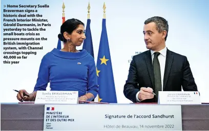  ?? Stefan Rousseau ?? Home Secretary Suella Braverman signs a historic deal with the French Interior Minister, Gérald Darmanin, in Paris yesterday to tackle the small boats crisis as pressure mounts on the British immigratio­n system, with Channel crossings topping
40,000 so far this year