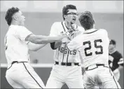  ?? Brett Coomer Associated Press ?? TEXAS A&M’S George Janca had winning hit, then celebrated with Tim Lichty (2), Austin Homan (25).