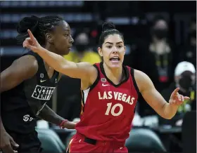  ?? ELAINE THOMPSON, FILE — THE ASSOCIATED PRESS ?? Las Vegas Aces’ Kelsey Plum is shown in action against the Seattle Storm during a WNBA basketball game in Everett, Washington, in this Saturday, May 15, 2021, file photo. Plum is the Sixth Woman of the Year, ending Las Vegas teammate Dearica Hamby’s two-year run as the league’s top reserve. Plum also earned the Comeback Player of the Year award, announced Wednesday, Sept. 22, 2021.