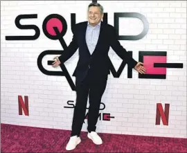  ?? Jordan Strauss Invision/Associated Press ?? NETFLIX CEO Ted Sarandos at an event promoting “Squid Game” last month. The streamer recently said it lost nearly 1 million subscriber­s last quarter.
