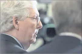  ?? ALEX BRANDON — THE ASSOCIATED PRESS ?? Senate Minority Leader Mitch McConnell speaks with reporters Tuesday before the Senate’s key test vote on the For the People Act, a sweeping voting rights bill.