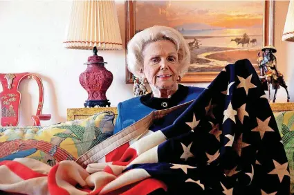  ?? [PHOTOS PROVIDED] ?? Patty Kelly Stevens holds the American flag her mother hid during their time at a Japanese POW camp in the Philippine­s. The flag will be presented to the U.S. Army Airborne and Special Operations Museum at Fort Bragg.