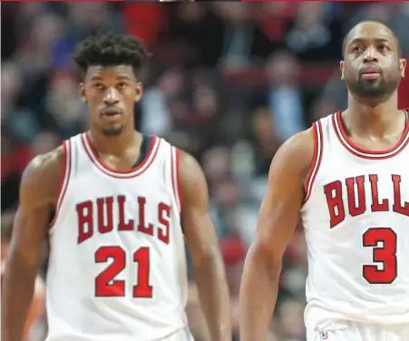  ?? | KAMIL KRZACZYNSK­I/ AP ?? Jimmy Butler ( left) and Dwyane Wade have been at the center of a controvers­y that has left the Bulls in disarray.