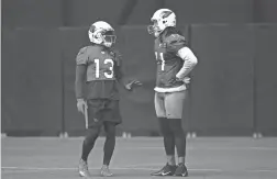  ?? ROB SCHUMACHER/THE REPUBLIC ?? Cardinals receivers Christian Kirk and Larry Fitzgerald converse during training camp on Friday in Glendale.