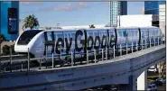  ?? (AP) ?? A monorail train sporting a Google advertisem­ent passes the Las Vegas Convention Center in January. The Justice Department reportedly is planning to file an antitrust case against Google as soon as this month.