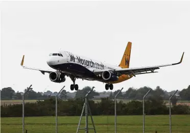  ?? — Bloomberg ?? Biggest failure: A Monarch Airlines passenger aircraft landing at London’s Luton Airport. Monarch filed for insolvency in Britain’s biggest-ever airline collapse, leaving the government to arrange the return of 110,000 tourists.