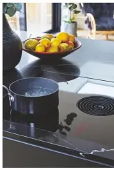  ??  ?? ABOVE ‘I DIDN’T WANT AN OVERHEAD APPLIANCE TO SPOIL THE CLEAN LINES – A HOB WITH A BUILT-IN EXTRACTOR SOLVES THAT ISSUE.’
Pure induction cooktop with integrated extractor, £1,900, Bora